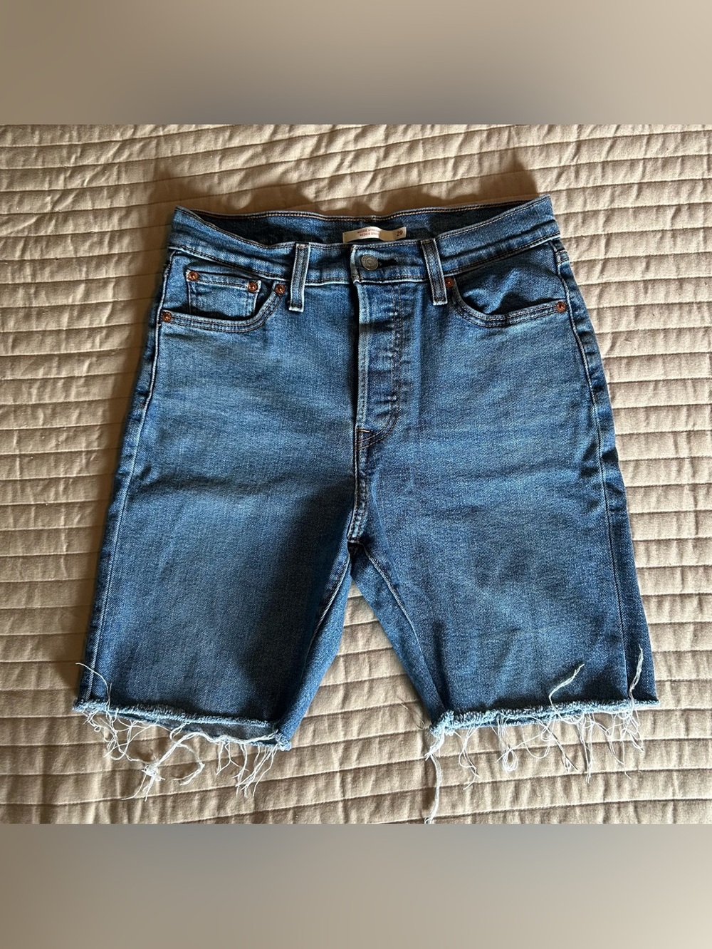 Blue Denim Levi’s Frayed Hem Women's Cut-Off Shorts